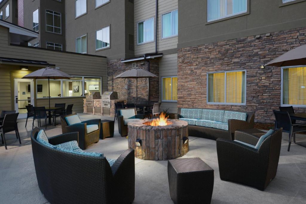 a patio with a fire pit and tables and chairs at Residence Inn by Marriott Denver Southwest/Littleton in Littleton