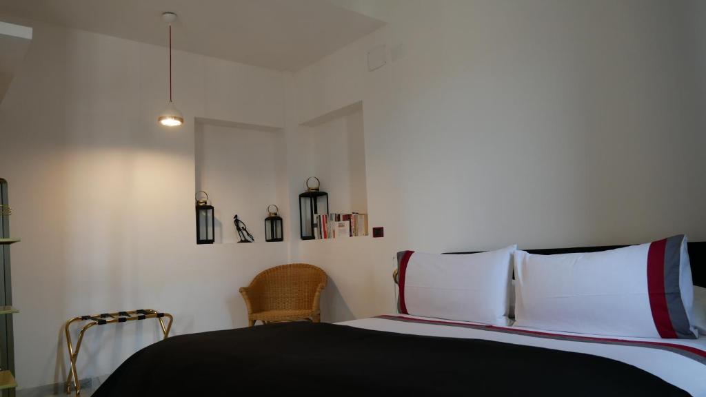 Postel nebo postele na pokoji v ubytování AN Deluxe Suites