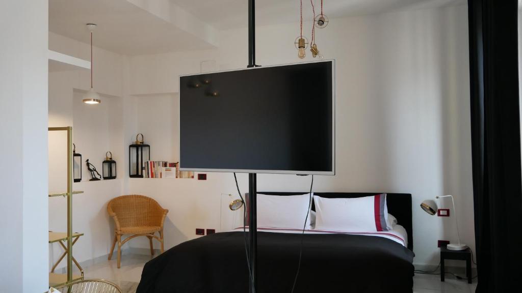 Postel nebo postele na pokoji v ubytování AN Deluxe Suites
