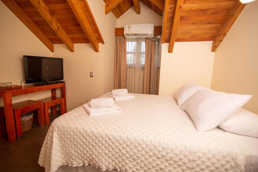 Uma cama ou camas num quarto em Vientos del Sur