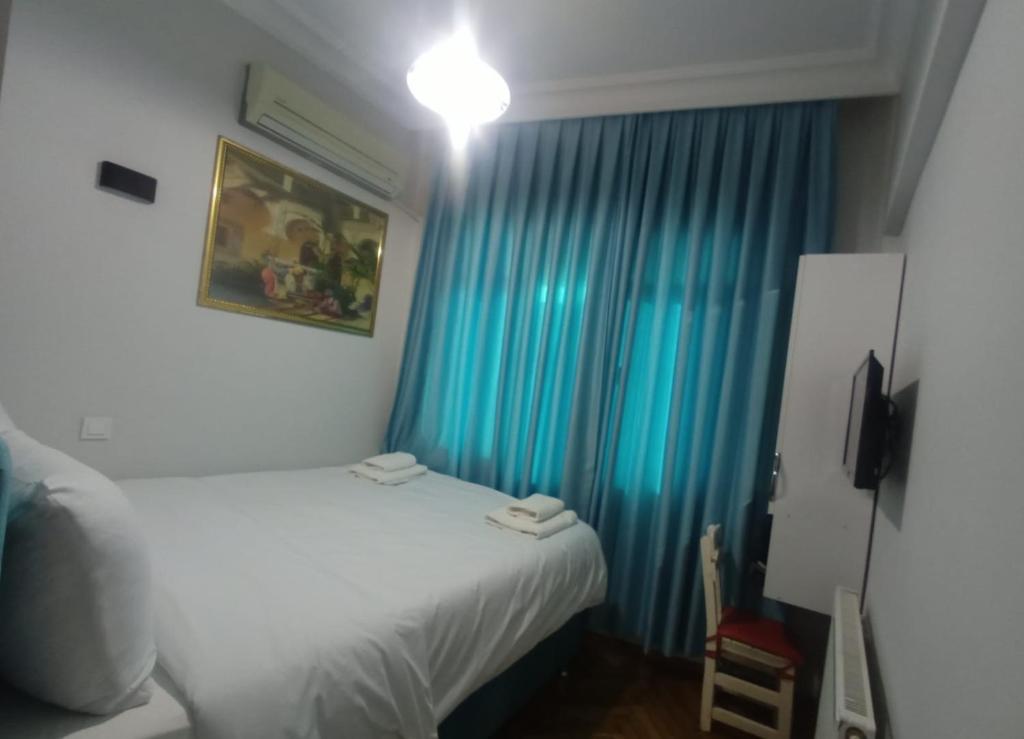 Postel nebo postele na pokoji v ubytování Buyukada Cinar Hotel