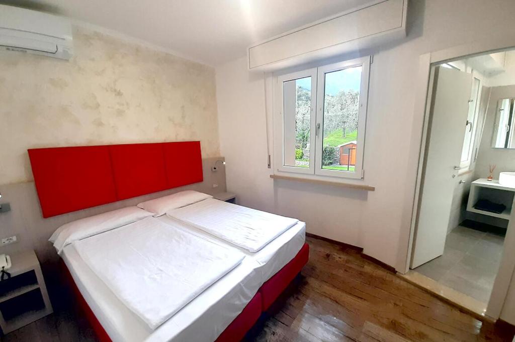 Postel nebo postele na pokoji v ubytování Hotel Da Tino