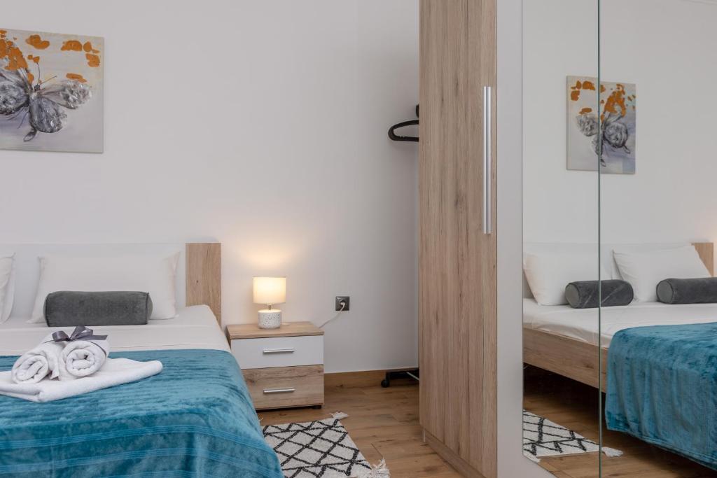 Posteľ alebo postele v izbe v ubytovaní Blue Mile Apartman Split