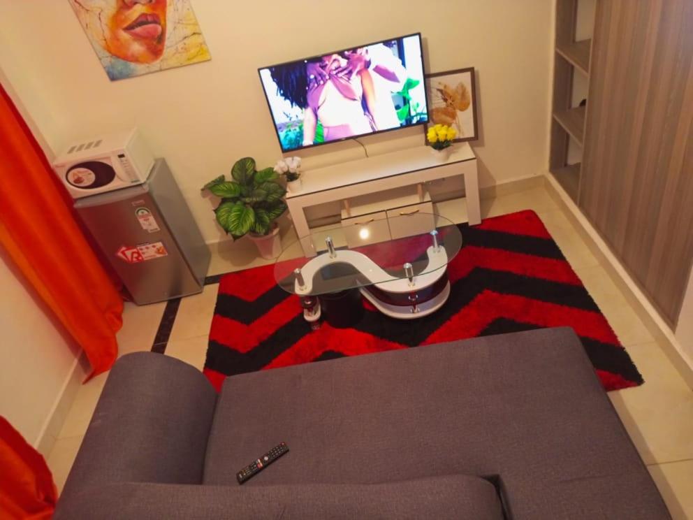 an overhead view of a living room with a television at Triad apartments in Nairobi