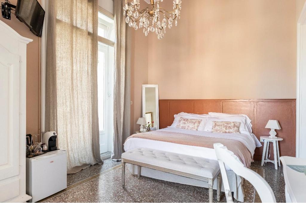 Postel nebo postele na pokoji v ubytování Joy's Bnb Ortigia