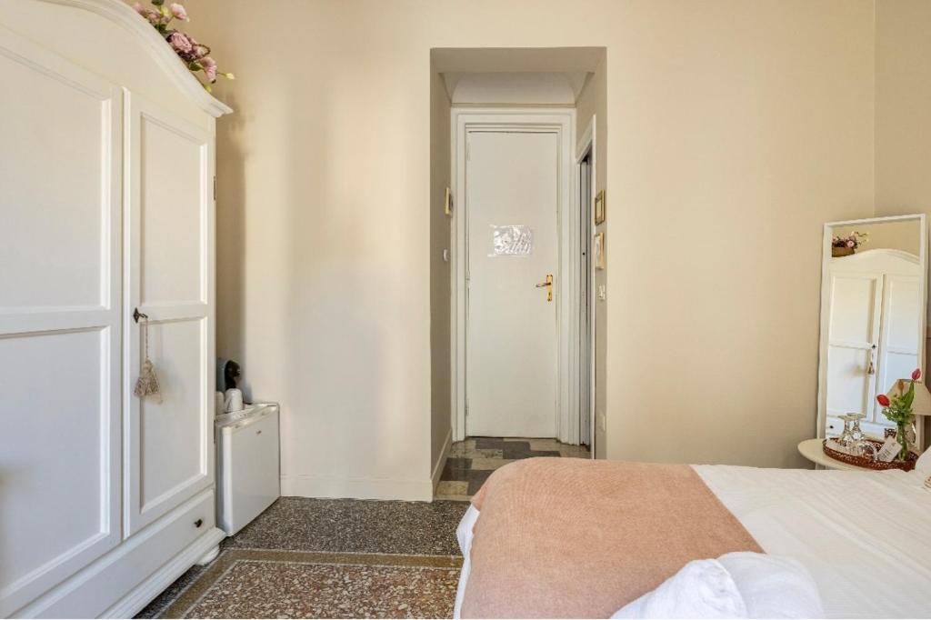 Postel nebo postele na pokoji v ubytování Joy's Bnb Ortigia