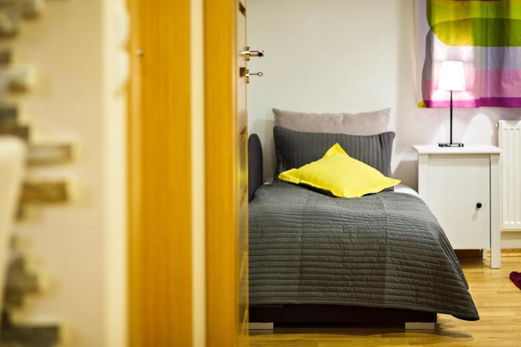 Posteľ alebo postele v izbe v ubytovaní Zakopane Apartamenty LUX
