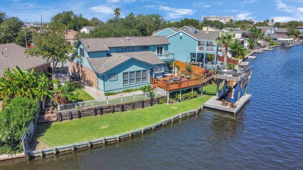 an aerial view of a house on the water at Beauty on the Water! Lake House near the beaches! in Galveston