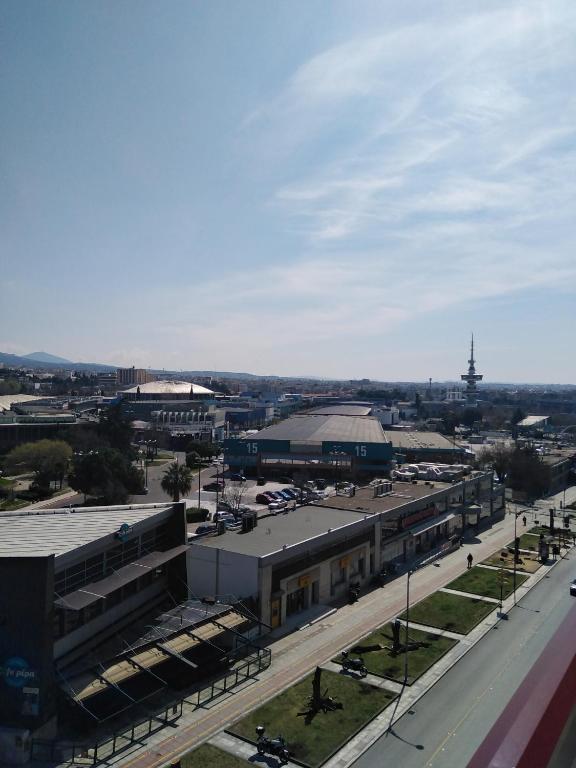 an aerial view of a city with a train station at Abc Hotel in Thessaloniki