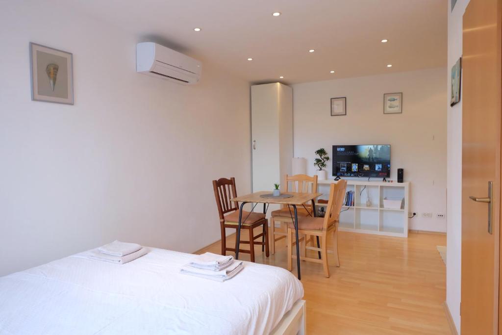 Postel nebo postele na pokoji v ubytování Bivalvia Apartments