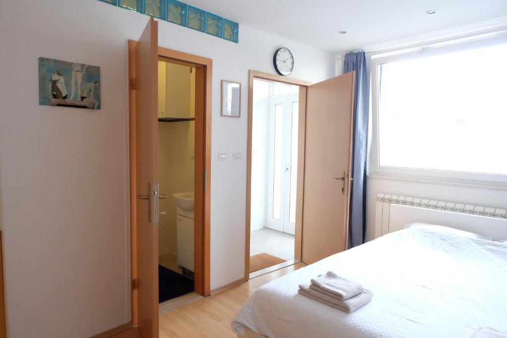 Postel nebo postele na pokoji v ubytování Bivalvia Apartments
