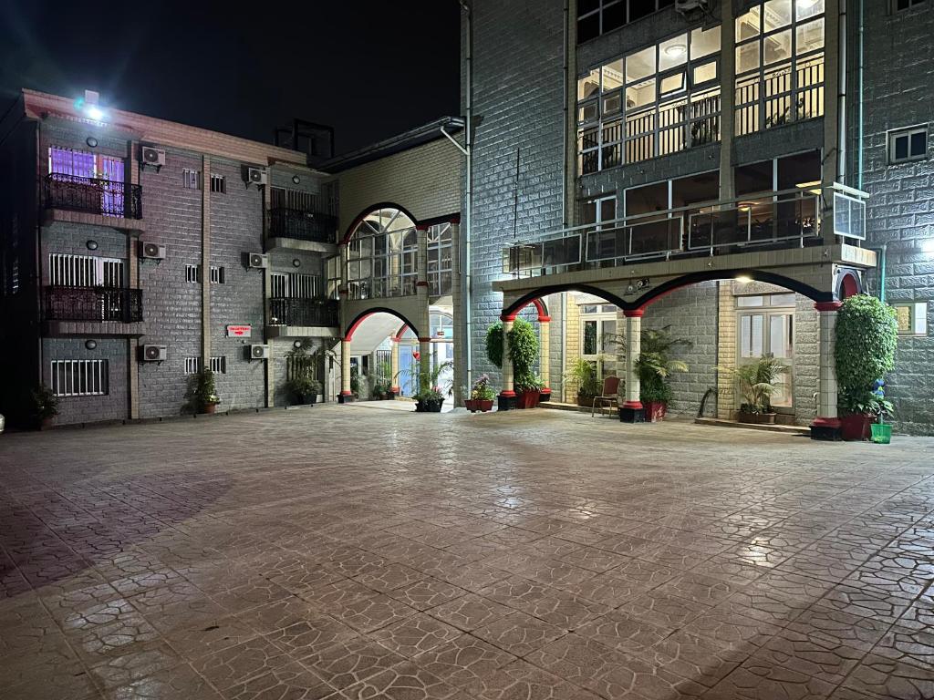 an empty parking lot in a building at night at Prodiges Hôtel in Yaoundé
