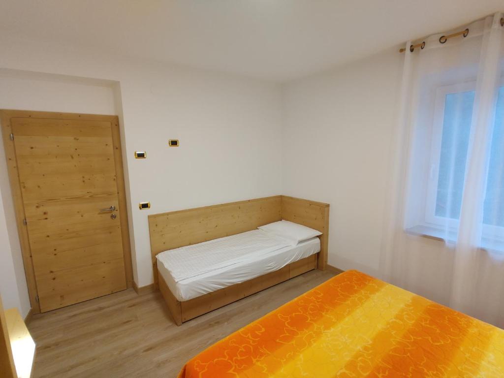 Postel nebo postele na pokoji v ubytování Residenza Arnica