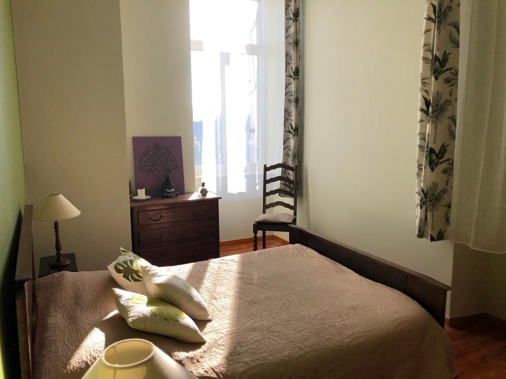 Postel nebo postele na pokoji v ubytování Le Logis du Gast chambre verte