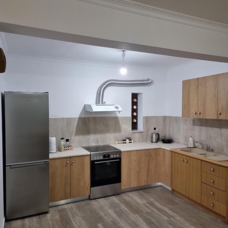 Kuchyň nebo kuchyňský kout v ubytování Sea View apartment