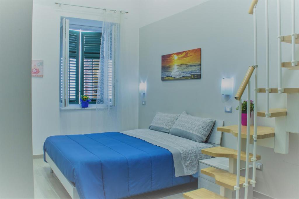En eller flere senge i et værelse på Casa Vacanza Al Massimo