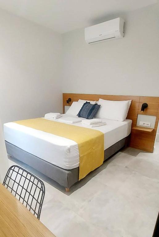 Кровать или кровати в номере Amimaya Apartments