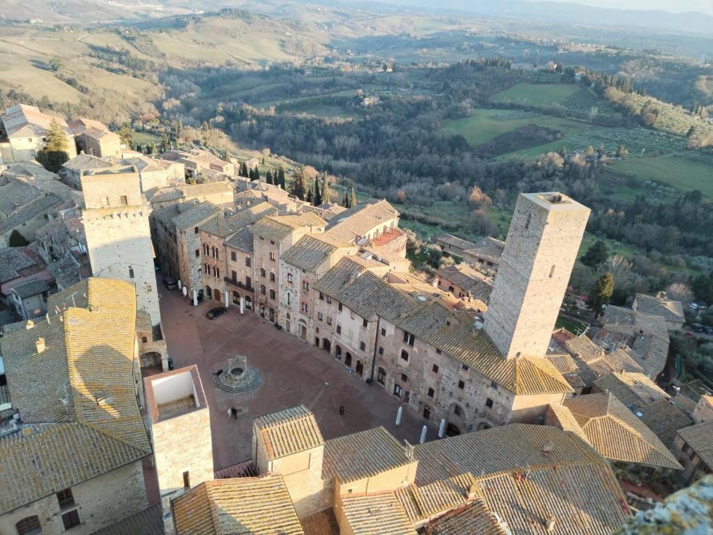 an aerial view of a city with buildings at APPARTAMENTO CISTERNA 33 in San Gimignano