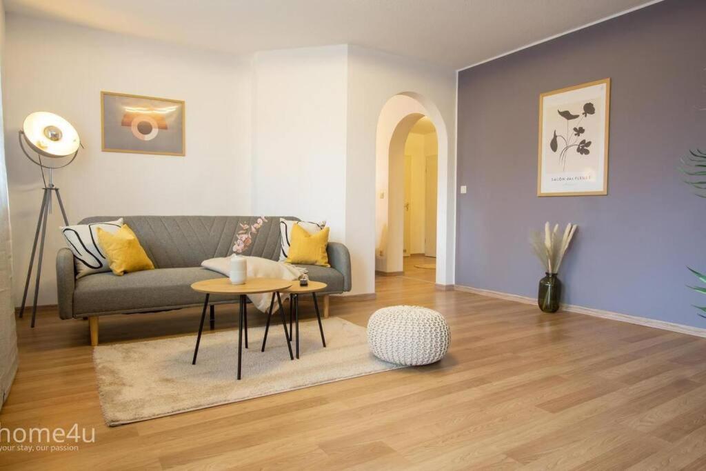 a living room with a couch and a table at Business-Apartment in Amberg