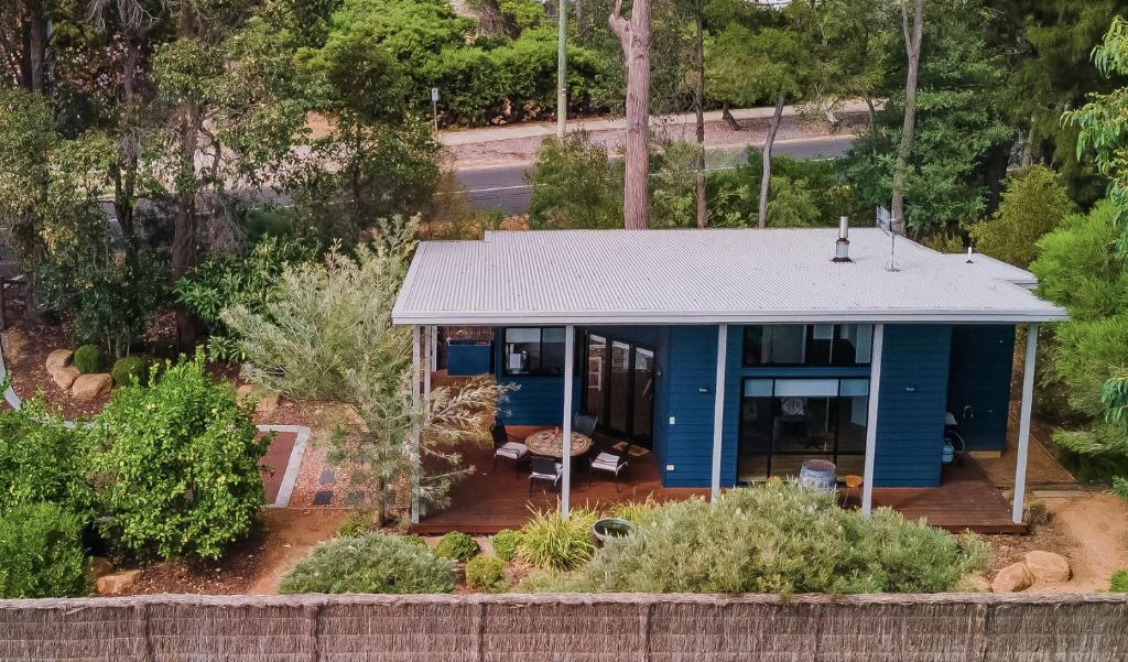 an aerial view of a blue house with a roof at The Dairy . Margaret River in Margaret River Town