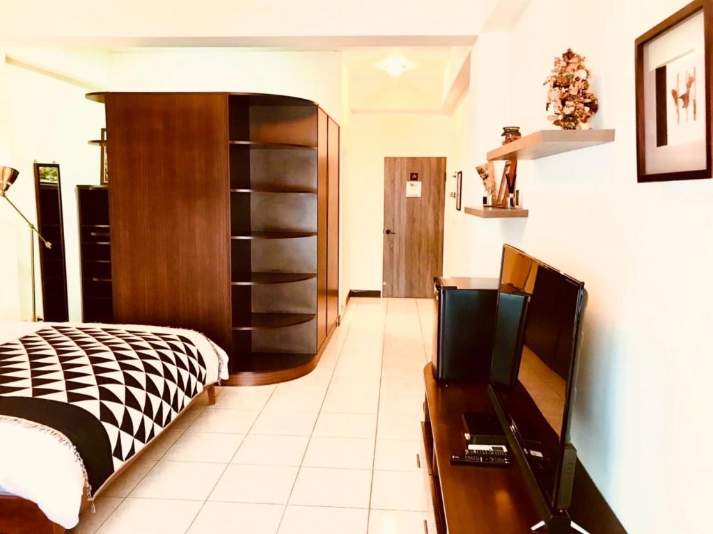 Postel nebo postele na pokoji v ubytování Grace Homestay
