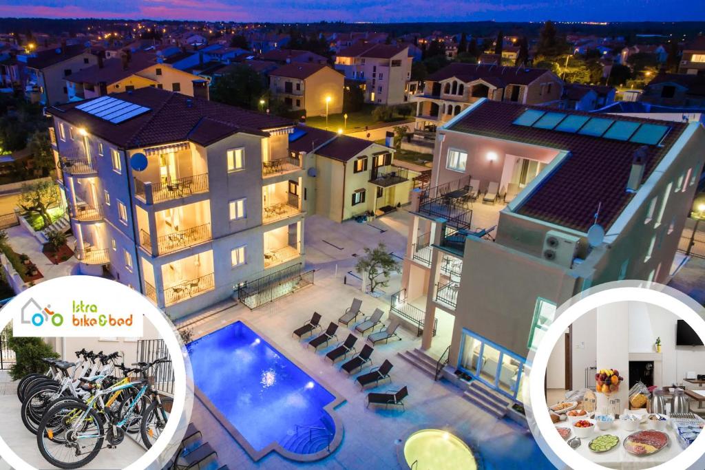 een luchtzicht op een huis met een zwembad bij Apartments Villa Nina in Fažana