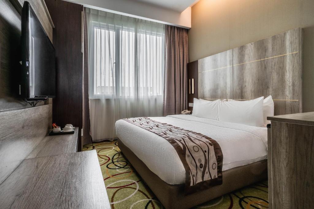 Postel nebo postele na pokoji v ubytování Ano Hotel