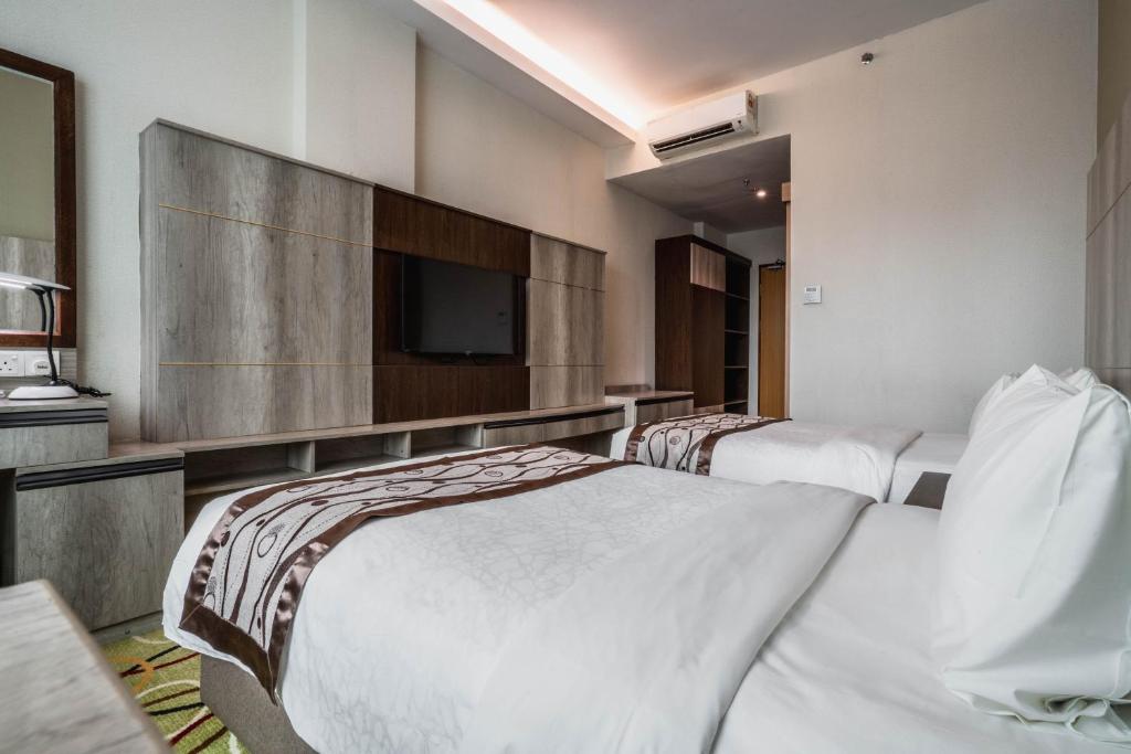 Postel nebo postele na pokoji v ubytování Ano Hotel