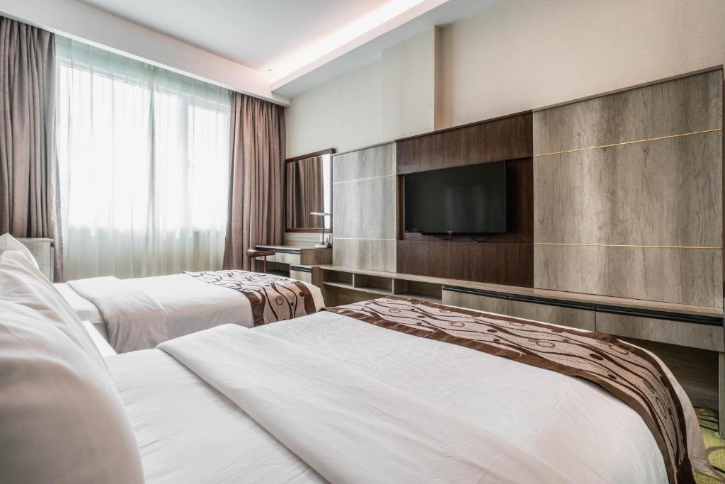 TV a/nebo společenská místnost v ubytování Ano Hotel