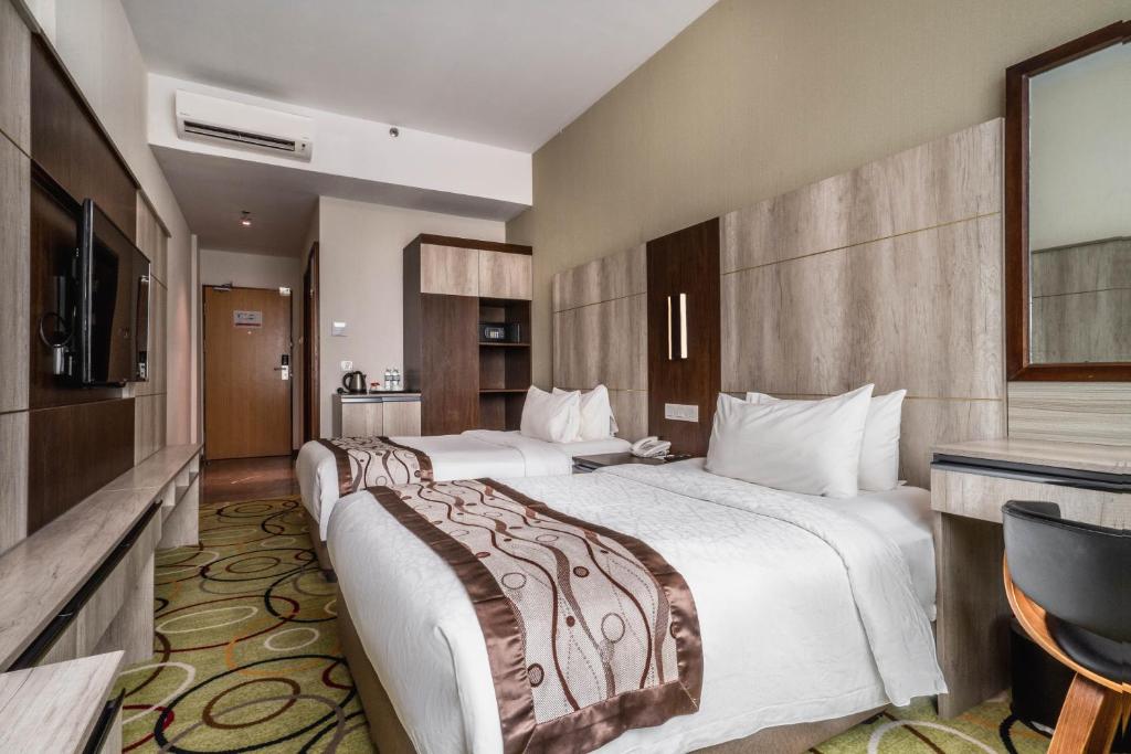 Postel nebo postele na pokoji v ubytování Ano Hotel