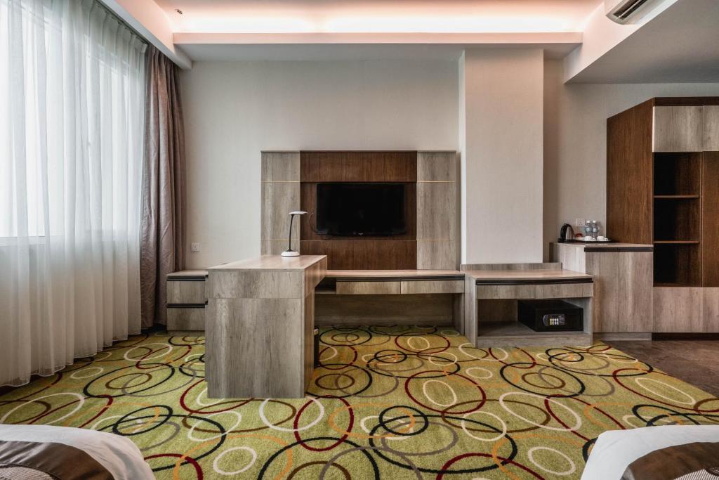 TV a/nebo společenská místnost v ubytování Ano Hotel