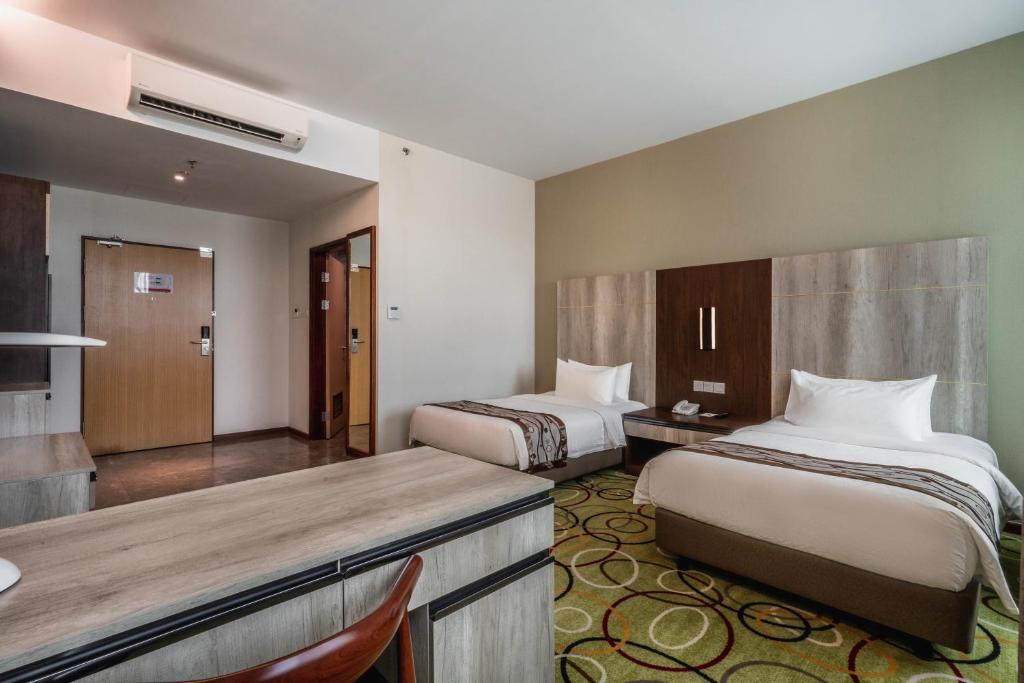 Postel nebo postele na pokoji v ubytování Ano Hotel
