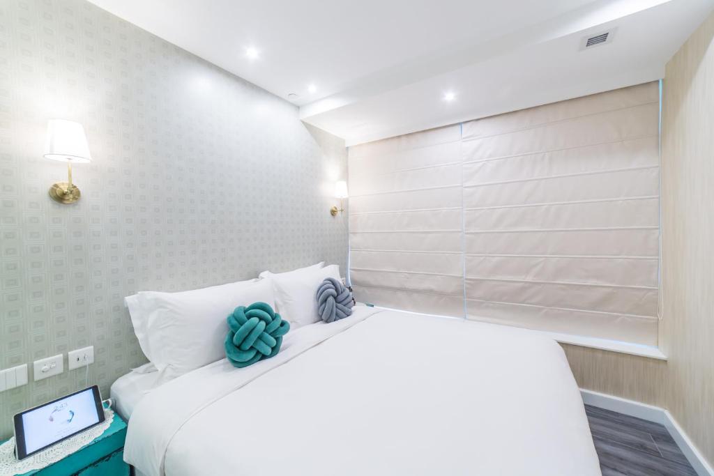 Voodi või voodid majutusasutuse Tung Nam Lou Art Hotel toas