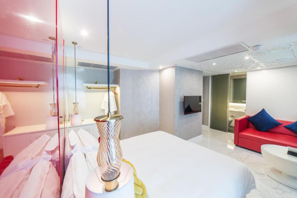 Voodi või voodid majutusasutuse Tung Nam Lou Art Hotel toas