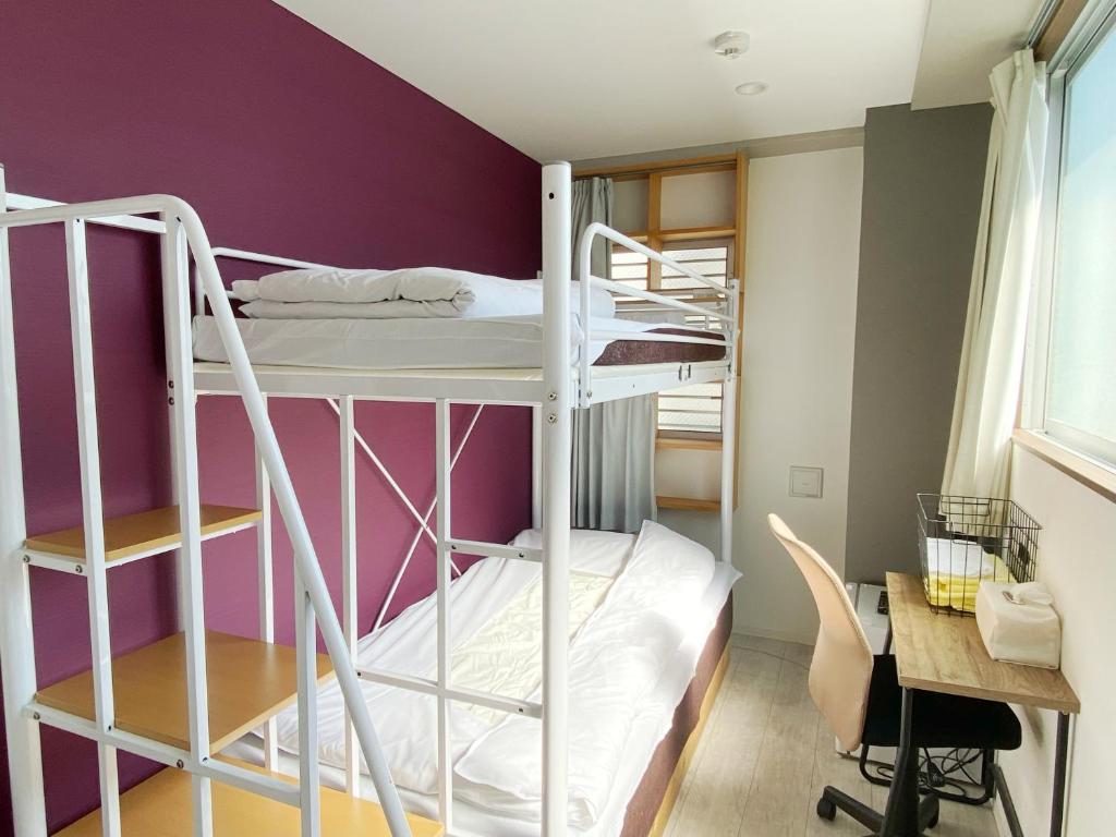 Postel nebo postele na pokoji v ubytování Hotel Mikado