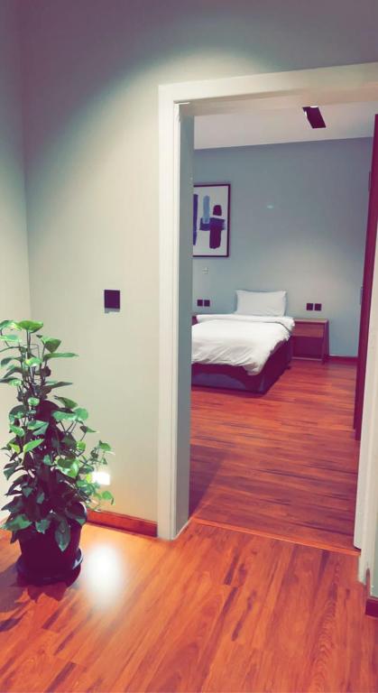 Postel nebo postele na pokoji v ubytování مساكن خاصة بتصميم فندقي ووصول ذاتي