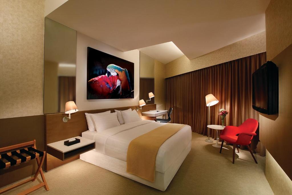 Postel nebo postele na pokoji v ubytování D'Hotel Singapore managed by The Ascott Limited