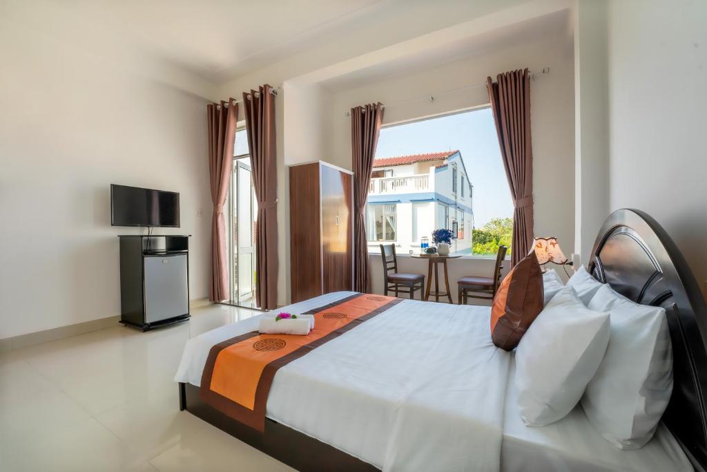 Giường trong phòng chung tại Sam Sam Homestay