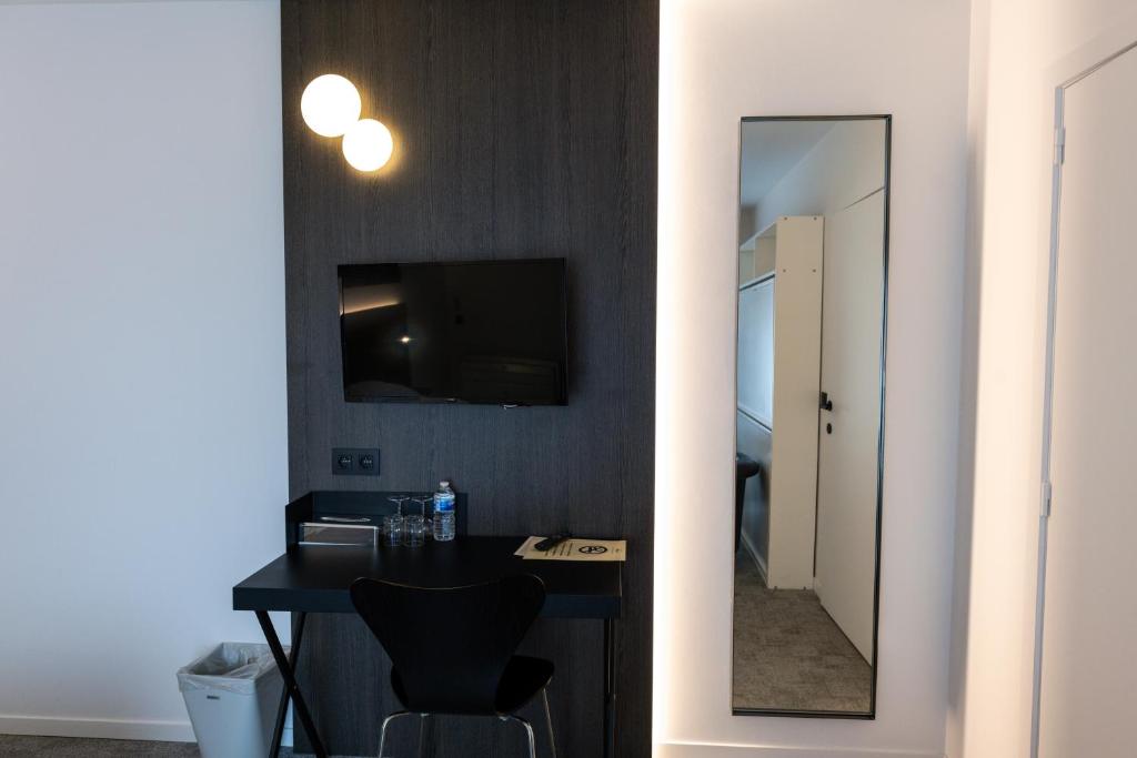 TV a/nebo společenská místnost v ubytování Hotel Apostroff