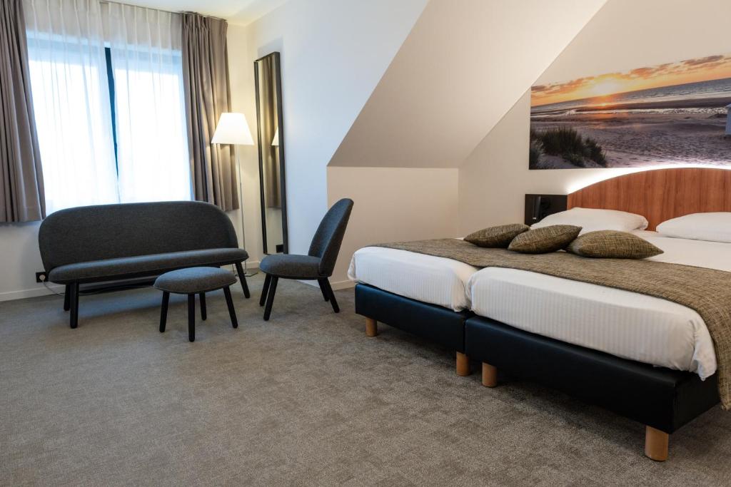 Postel nebo postele na pokoji v ubytování Hotel Apostroff