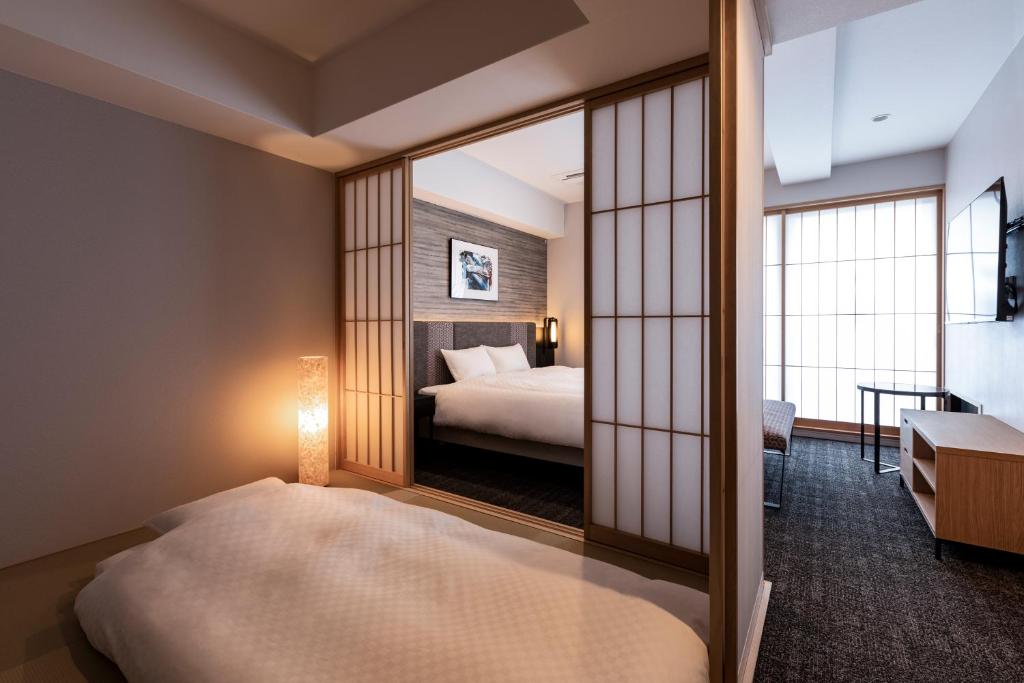 Rinn Kyoto Station客房内的一张或多张床位