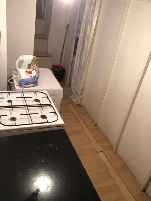 a stove top oven sitting in a kitchen next to a hallway at • Beachside Flat Entrance Flat With Mezzanine Floor ~~ Asma Katlı Sahil Yanı Düz Giriş Daire • in Istanbul