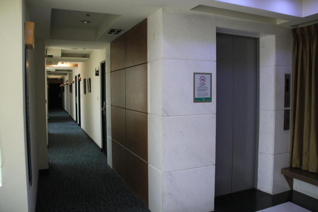 a hallway in a building with a hallway at CHECK inn Express Taichung Fengchia in Taichung