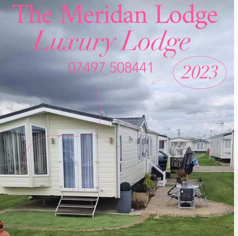 a sign that reads the meriden lodge luxury lodge at The Meridan Lodge - Platinum 2024 Season in Clacton-on-Sea