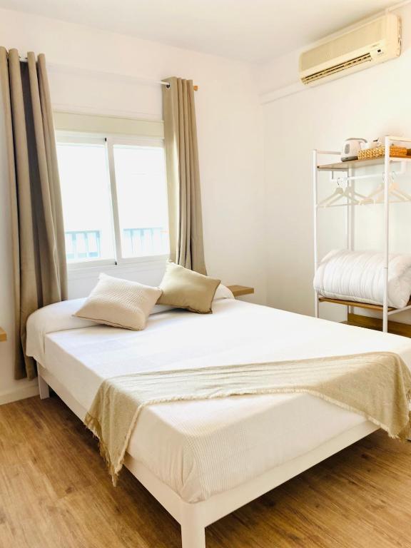 Postel nebo postele na pokoji v ubytování La Bartola Guesthouse