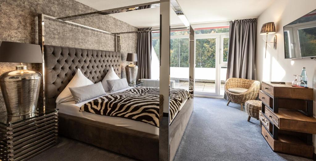 Postel nebo postele na pokoji v ubytování Hotel Luisenpark