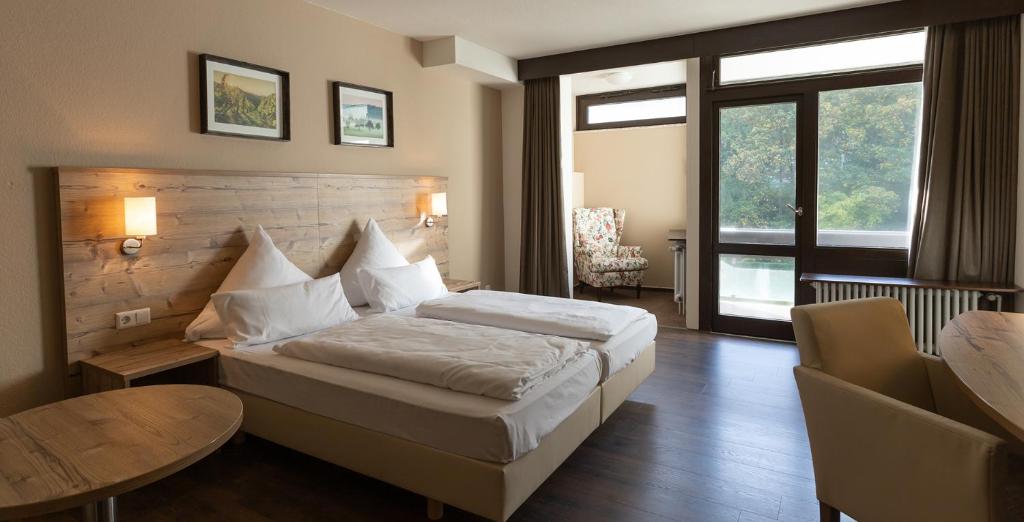 Postel nebo postele na pokoji v ubytování Hotel Luisenpark