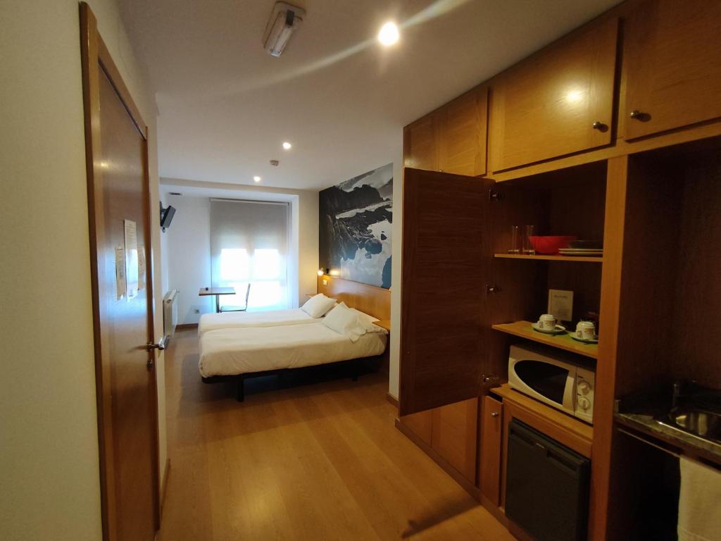 Kuchyň nebo kuchyňský kout v ubytování Hotel Dabeleira