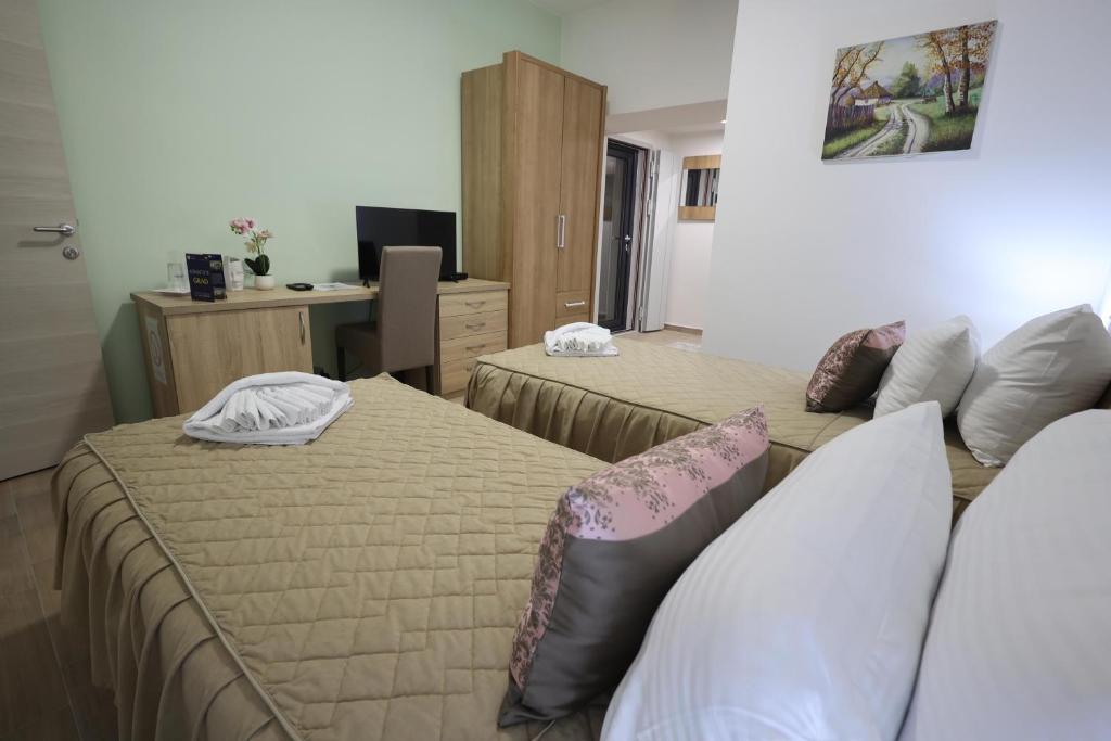 Postel nebo postele na pokoji v ubytování Konačište Grad B&B