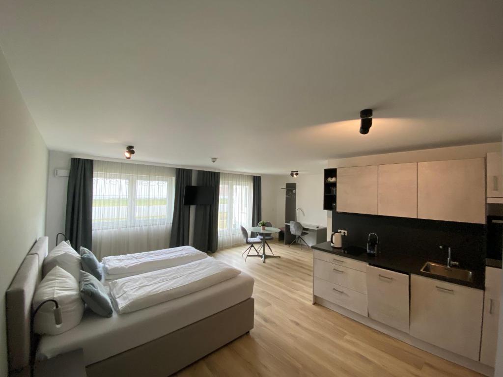 Kuchyň nebo kuchyňský kout v ubytování Snooze Apartments Alling